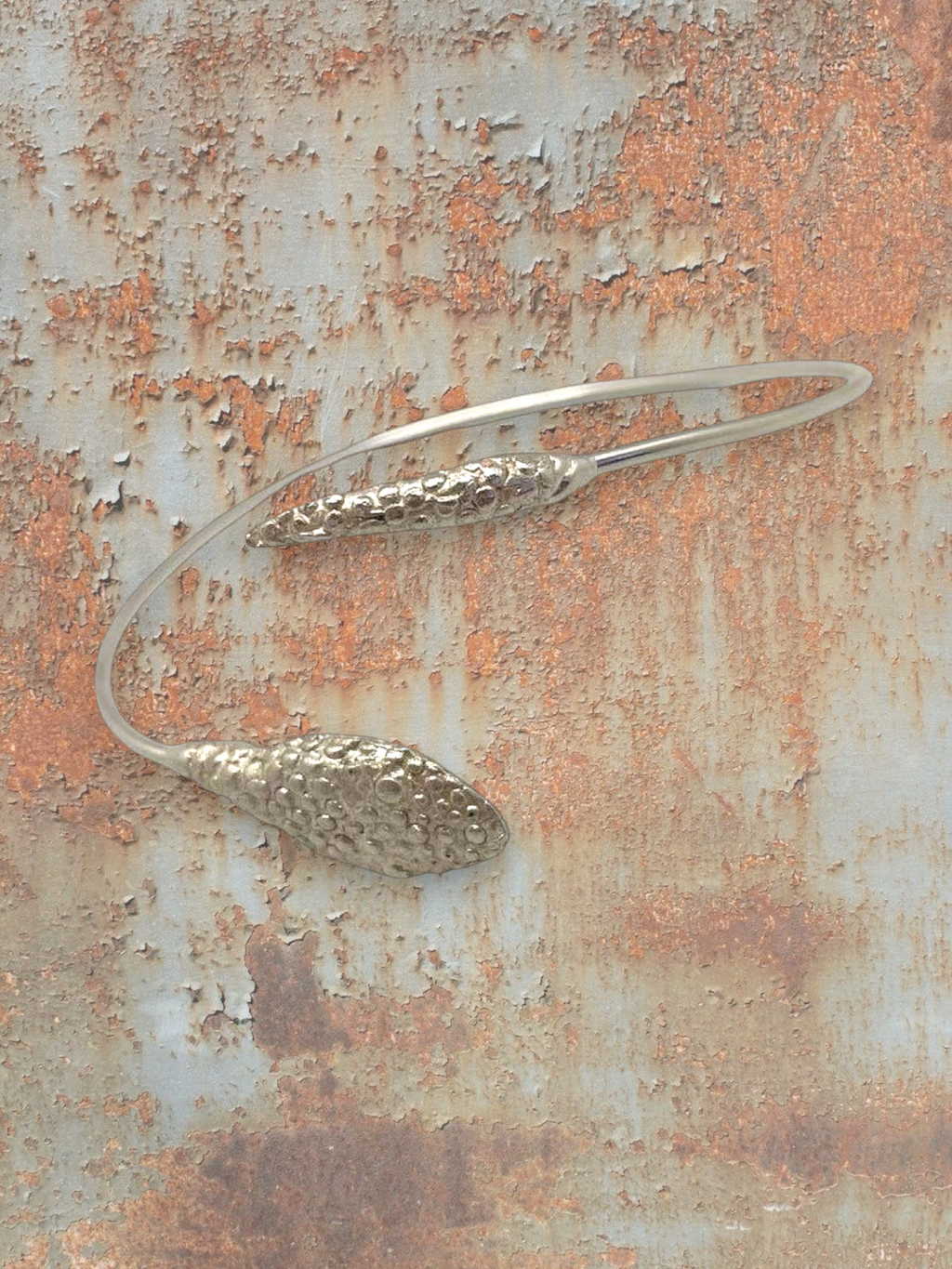 WILDSIDE silver-tone metal sculptural open neck ring with textured pod details. Modern choker necklace.