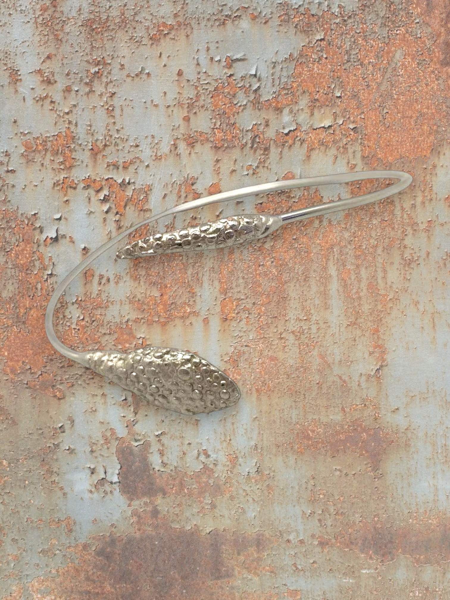 WILDSIDE silver-tone metal sculptural open neck ring with textured pod details. Modern choker necklace.