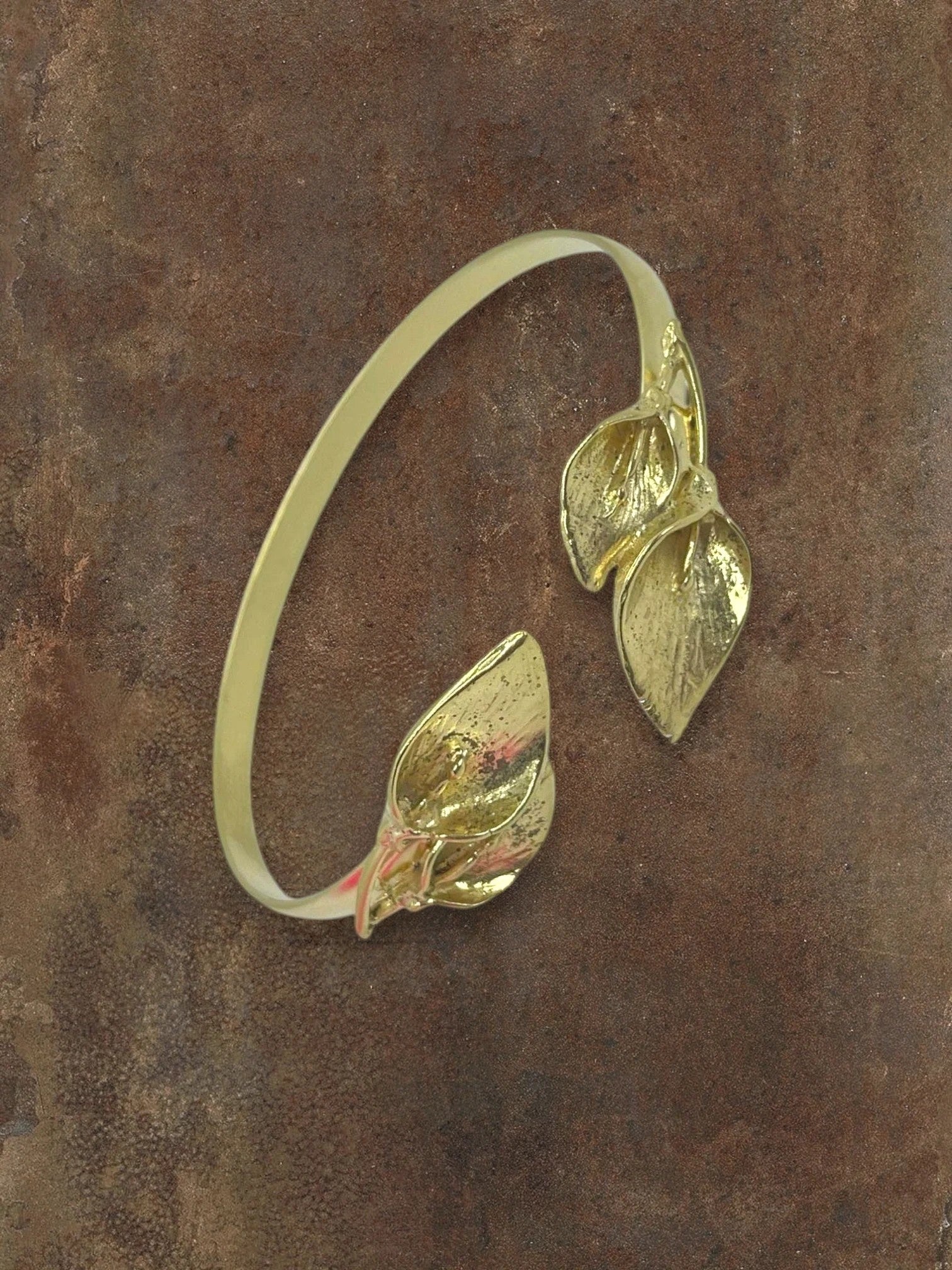 WILDSIDE gold leaf cuff bracelet with intricate realistic leaf motifs, open cuff design.