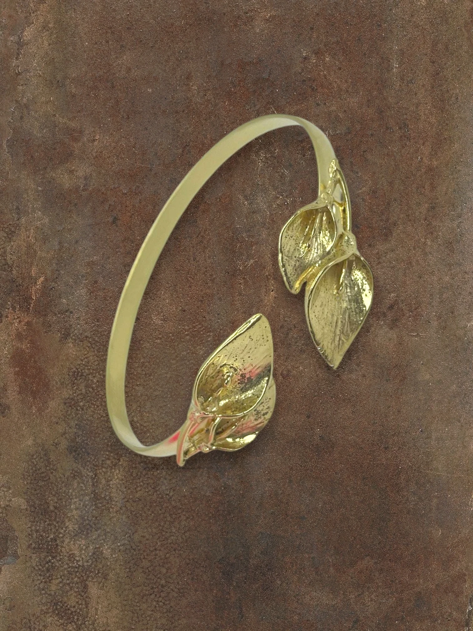 WILDSIDE gold leaf cuff bracelet with intricate realistic leaf motifs, open cuff design.