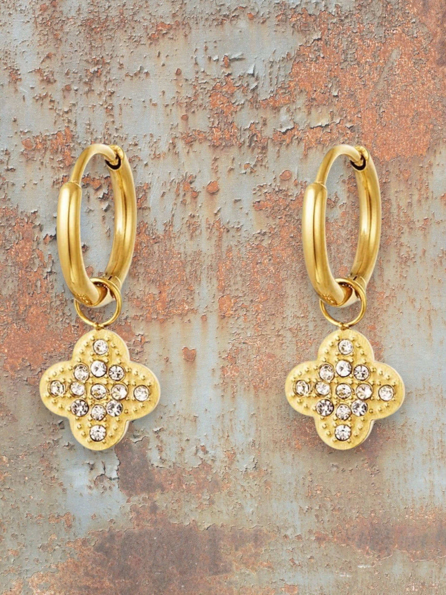 WILDSIDE gold-tone hoop earrings with sparkling cubic zirconia clover charms.