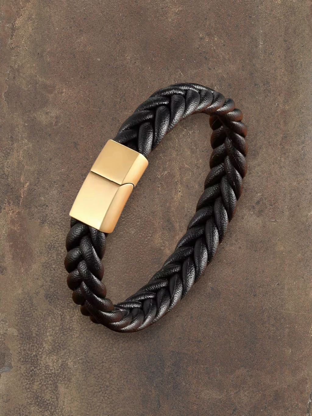 WILDSIDE black braided leather bracelet with gold-tone magnetic clasp. Surgical steel detail.
