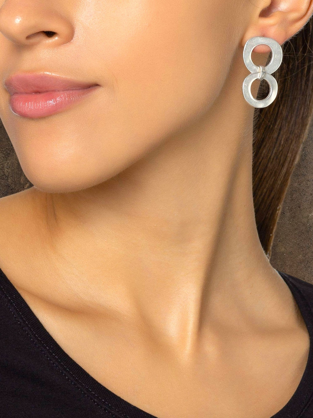 WILDSIDE silver-tone metal interlocking double hoop earrings with a polished finish.