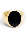 Gouden ring met zwarte steen rond