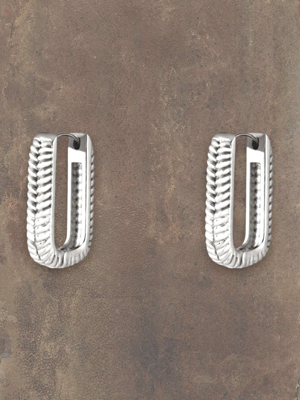 WILDSIDE silver rectangular hoop earrings with a textured rope design. Modern statement jewelry.
