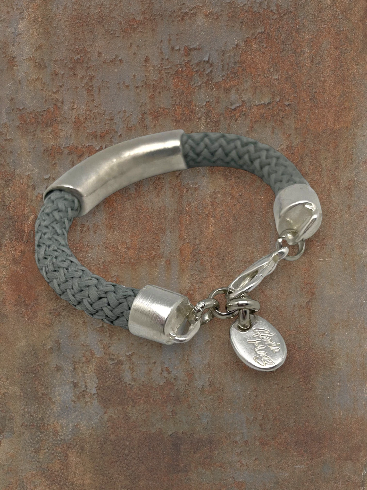 WILDSIDE gray cotton cord bracelet with silver-plated zamak tube and lobster clasp. Exclusive design.