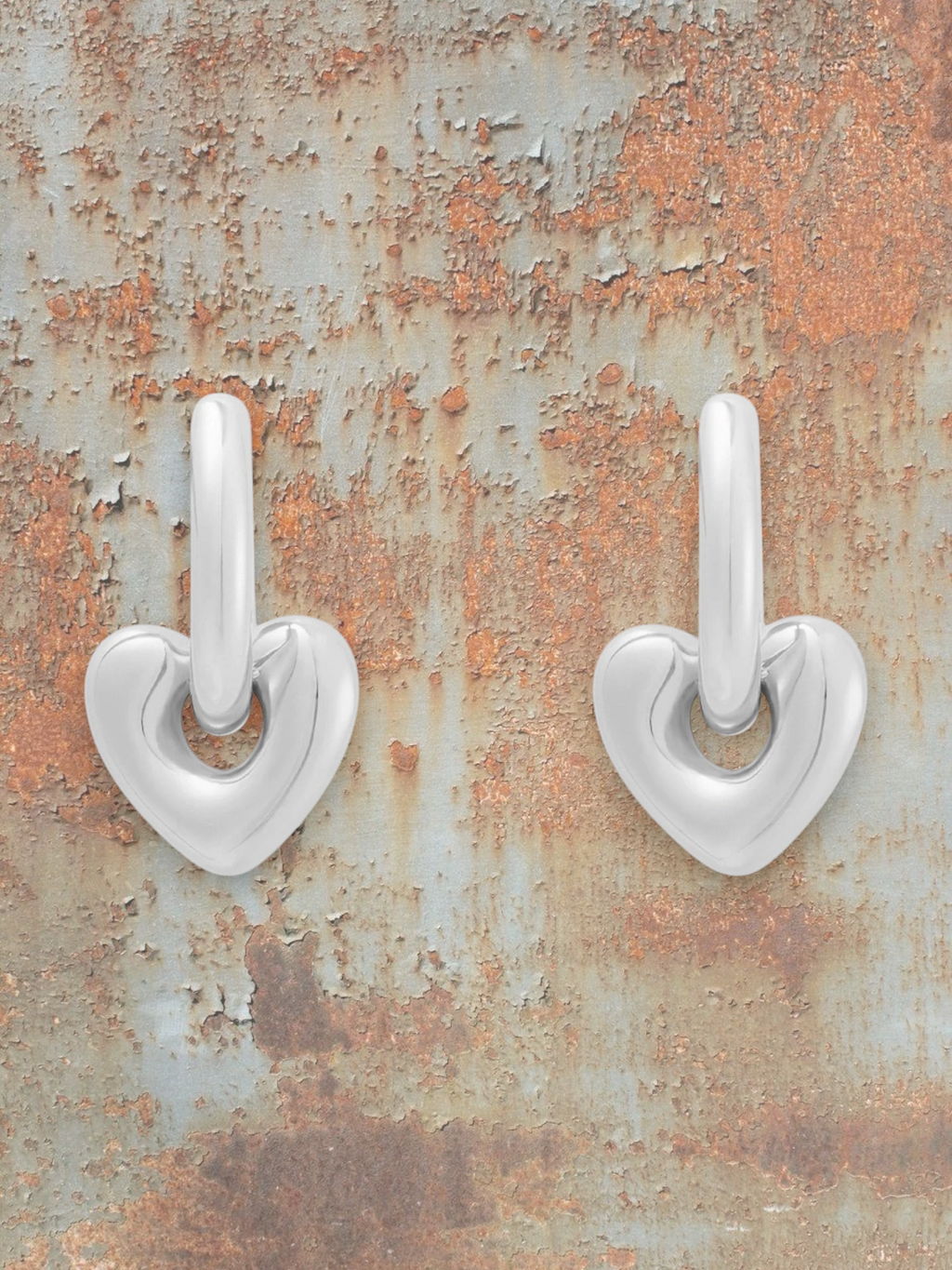 WILDSIDE silver steel heart shaped drop earrings with a modern sculpted design and sleek hoop.
