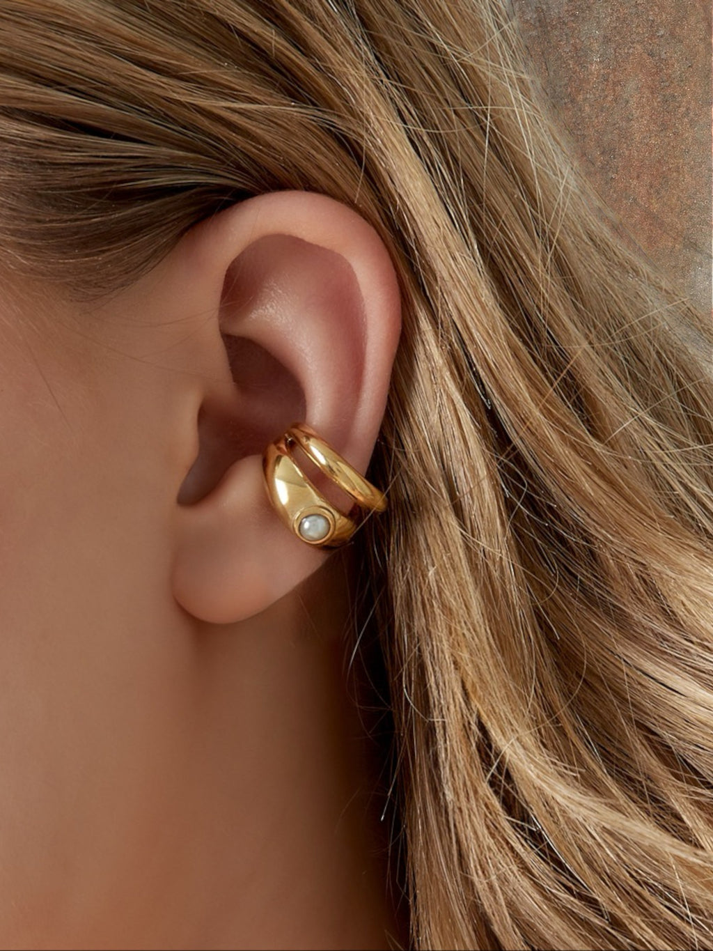 WILDSIDE gold-tone sculptural ear cuff with pearl accent, no piercing required.