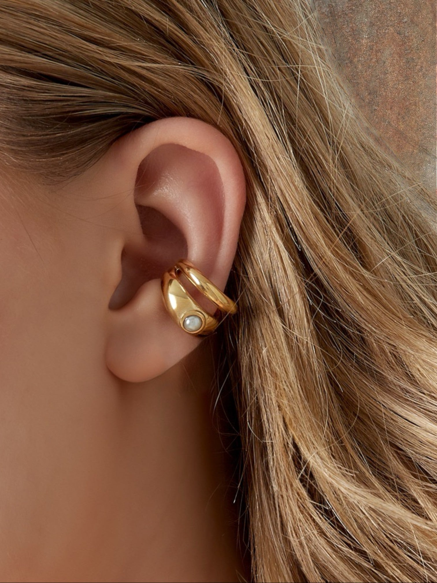 WILDSIDE gold-tone sculptural ear cuff with pearl accent, no piercing required.