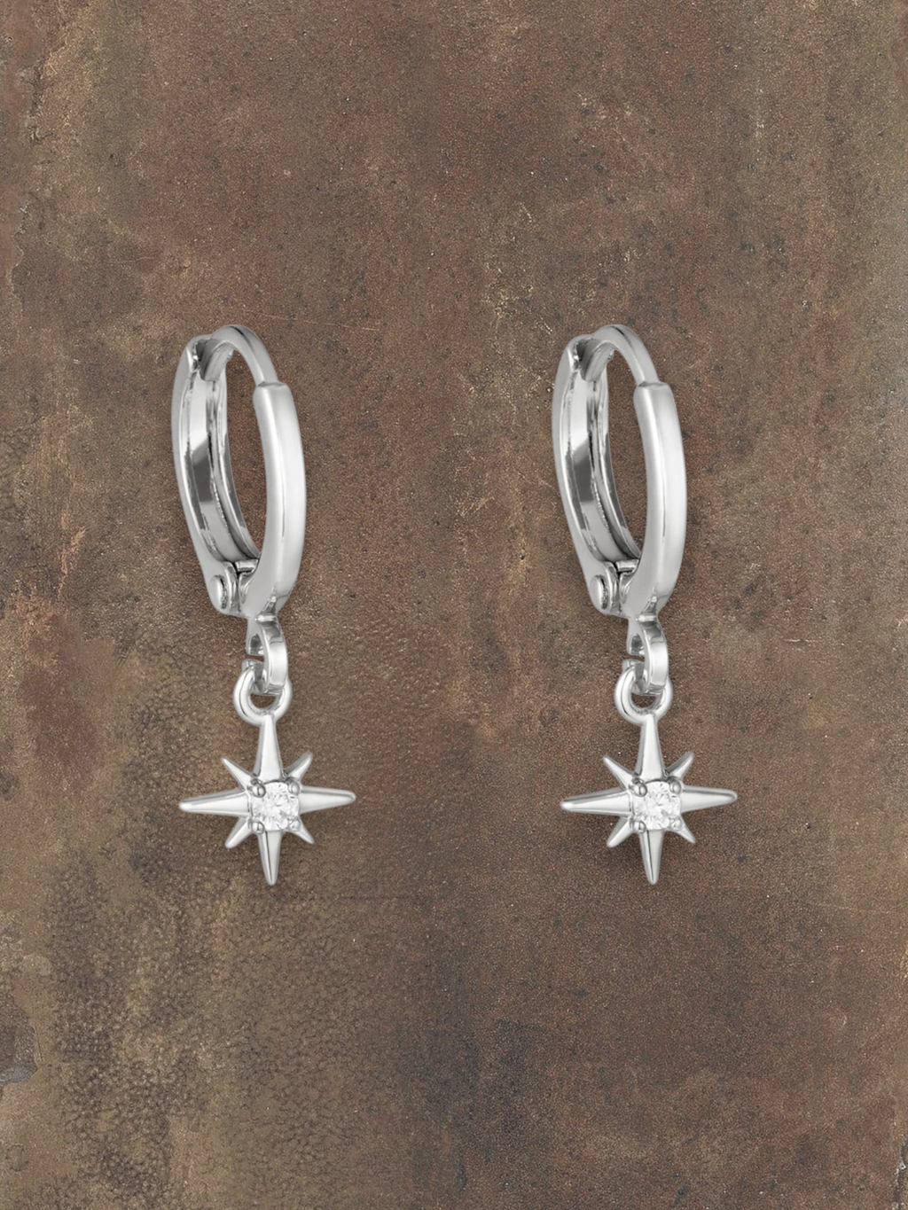 WILDSIDE silver hoop earrings with small star pendant and clear crystal accent.