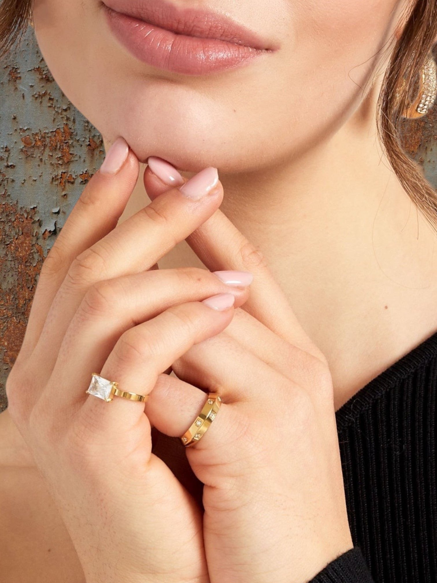 WILDSIDE gold stainless steel ring with square-cut clear stone and band with small stones.