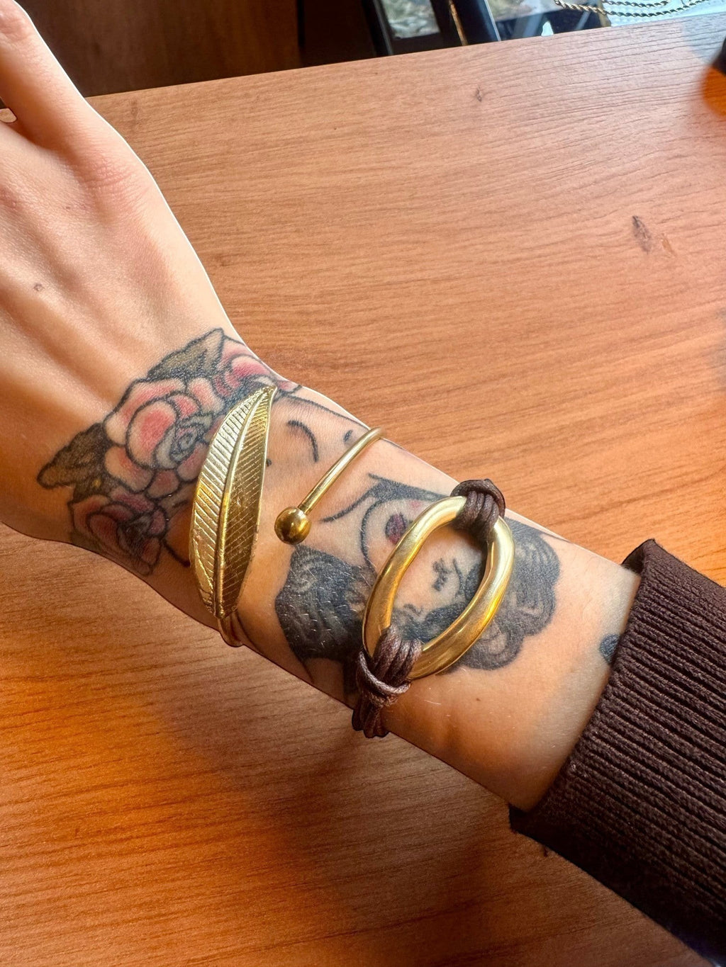 WILDSIDE polished brass leaf cuff bracelet with adjustable open design and organic artistry.