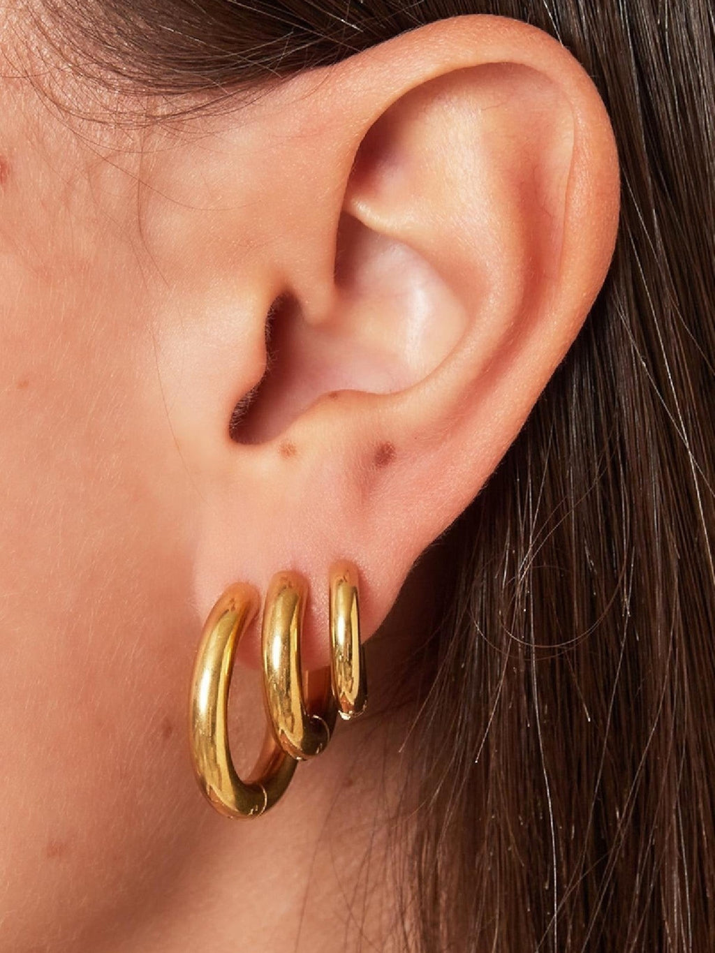 WILDSIDE small gold hoop earrings set of three, polished metal.