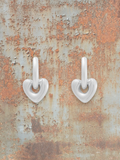 WILDSIDE polished silver steel heart shaped drop earrings with sleek hoops.
