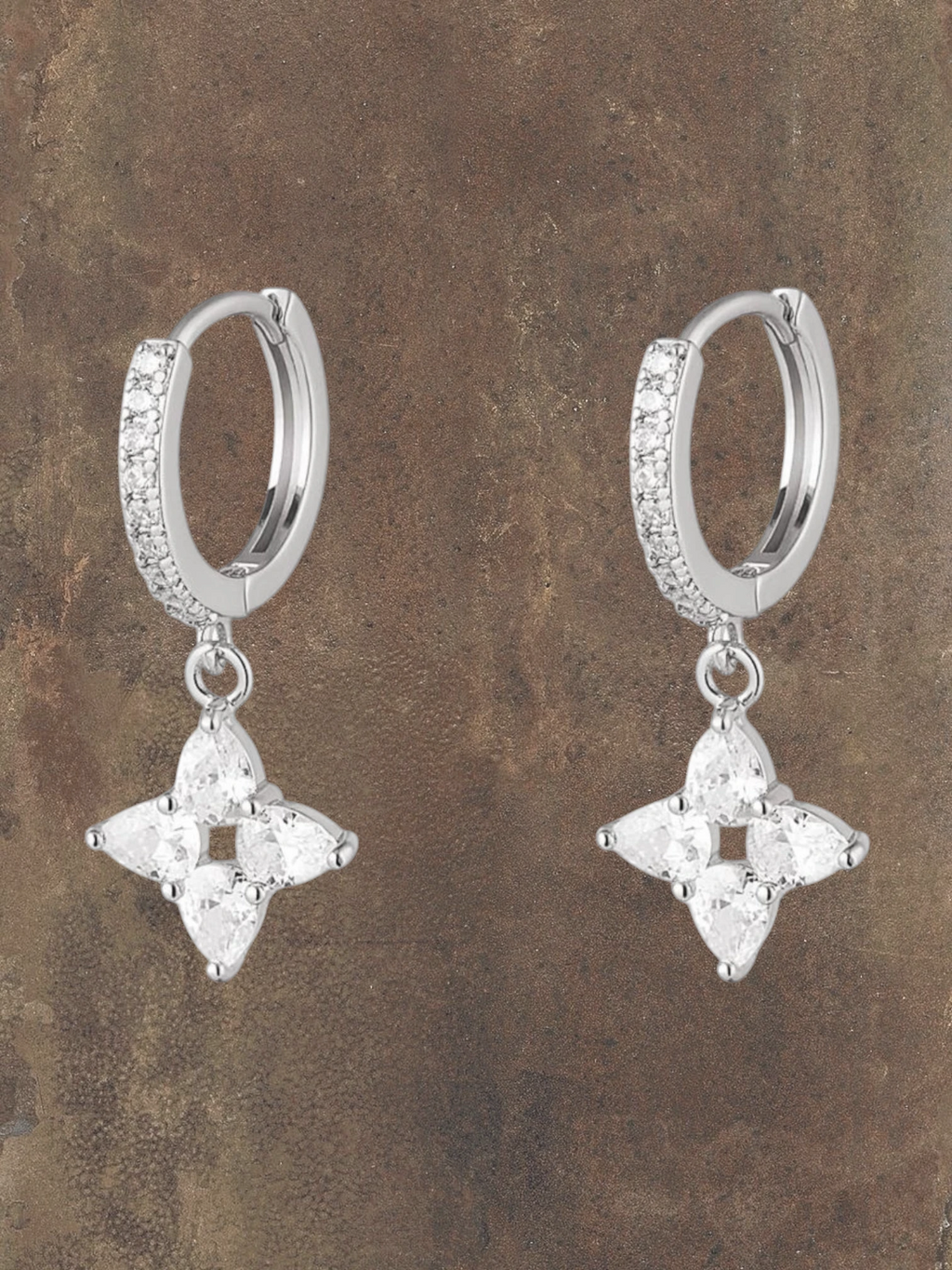 WILDSIDE sparkling flower drop earrings with cubic zirconia on silver steel huggie hoops.