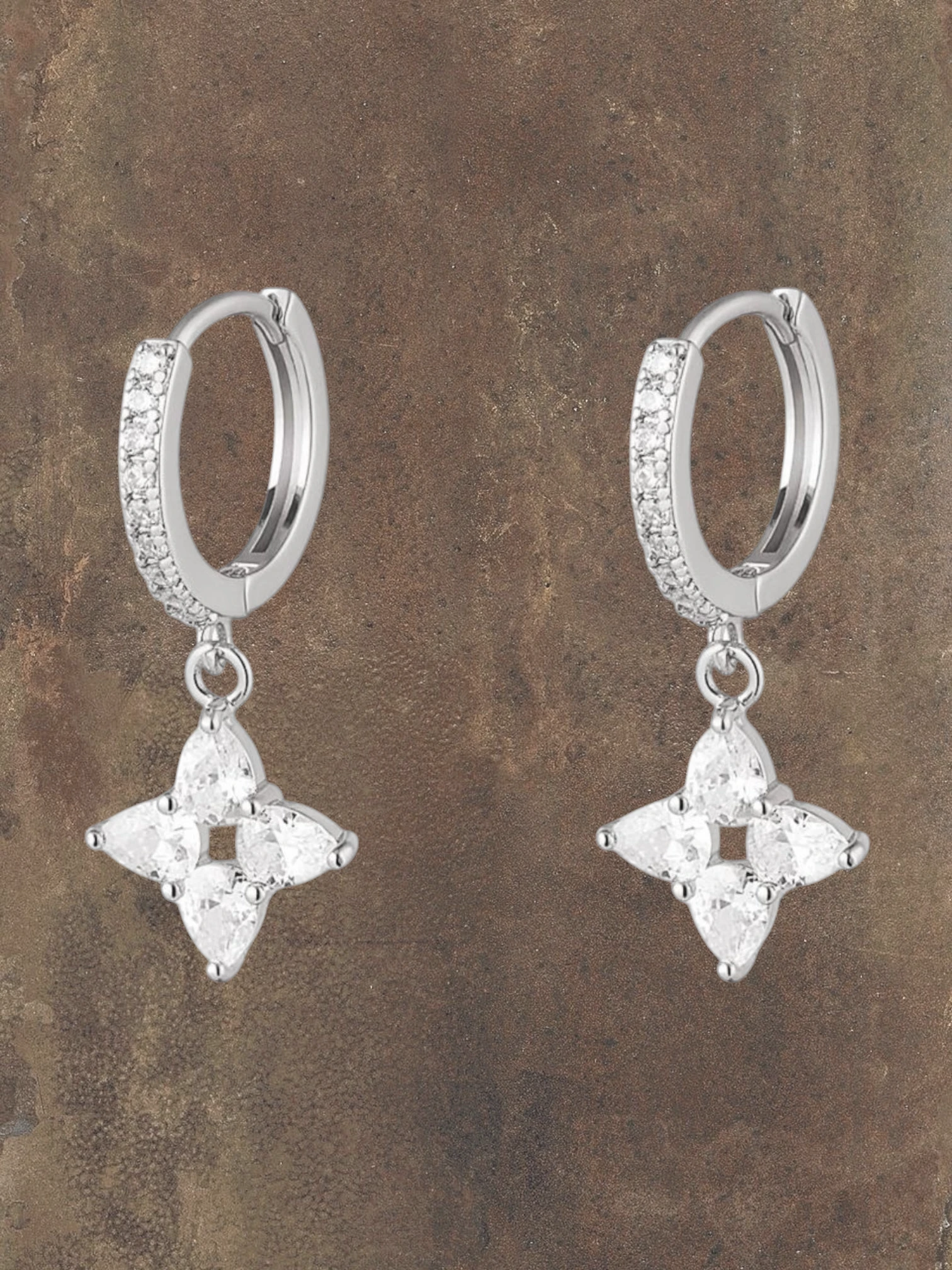 WILDSIDE sparkling flower drop earrings with cubic zirconia on silver steel huggie hoops.