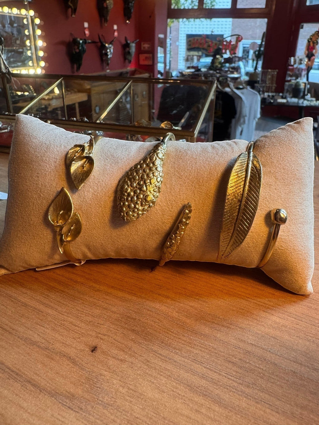 WILDSIDE polished brass leaf cuff bracelet with adjustable open design. Nature-inspired jewelry.