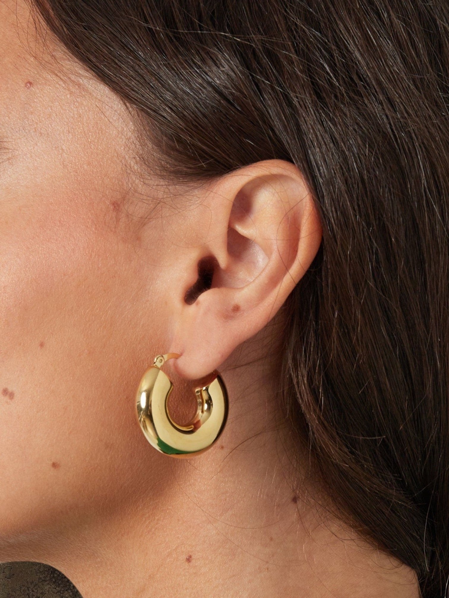 WILDSIDE chunky gold-tone metal dome hoop earrings with a polished finish.