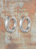 WILDSIDE medium thick polished metal hoop earrings in silver. Classic, bold, and sophisticated.