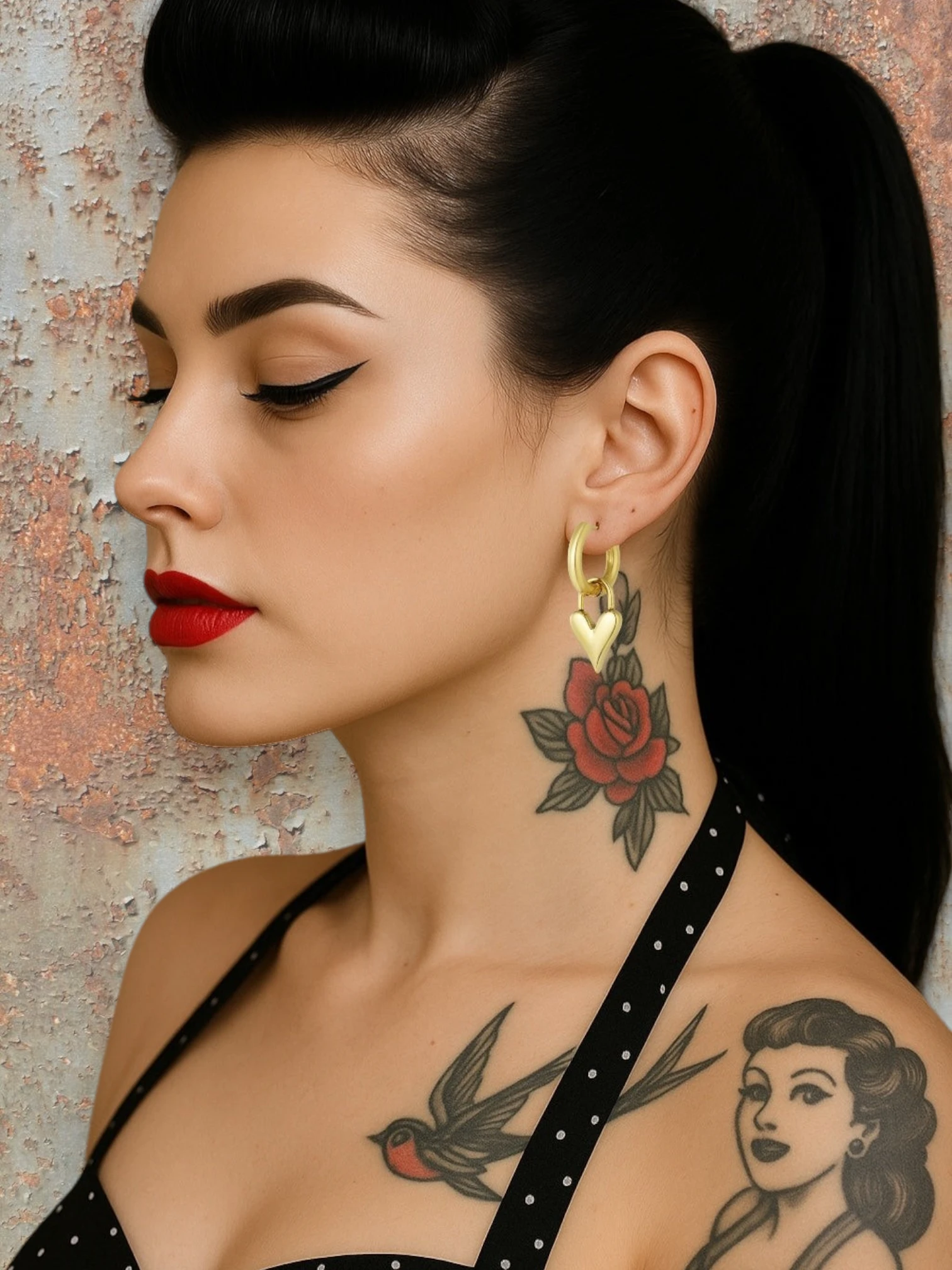 WILDSIDE gold heart lock hoop earrings with polished metal finish. Classic hoops with dangling heart charms.