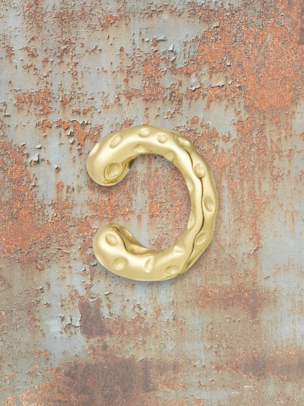 WILDSIDE gold ear cuff with textured dimple design, no piercing needed.