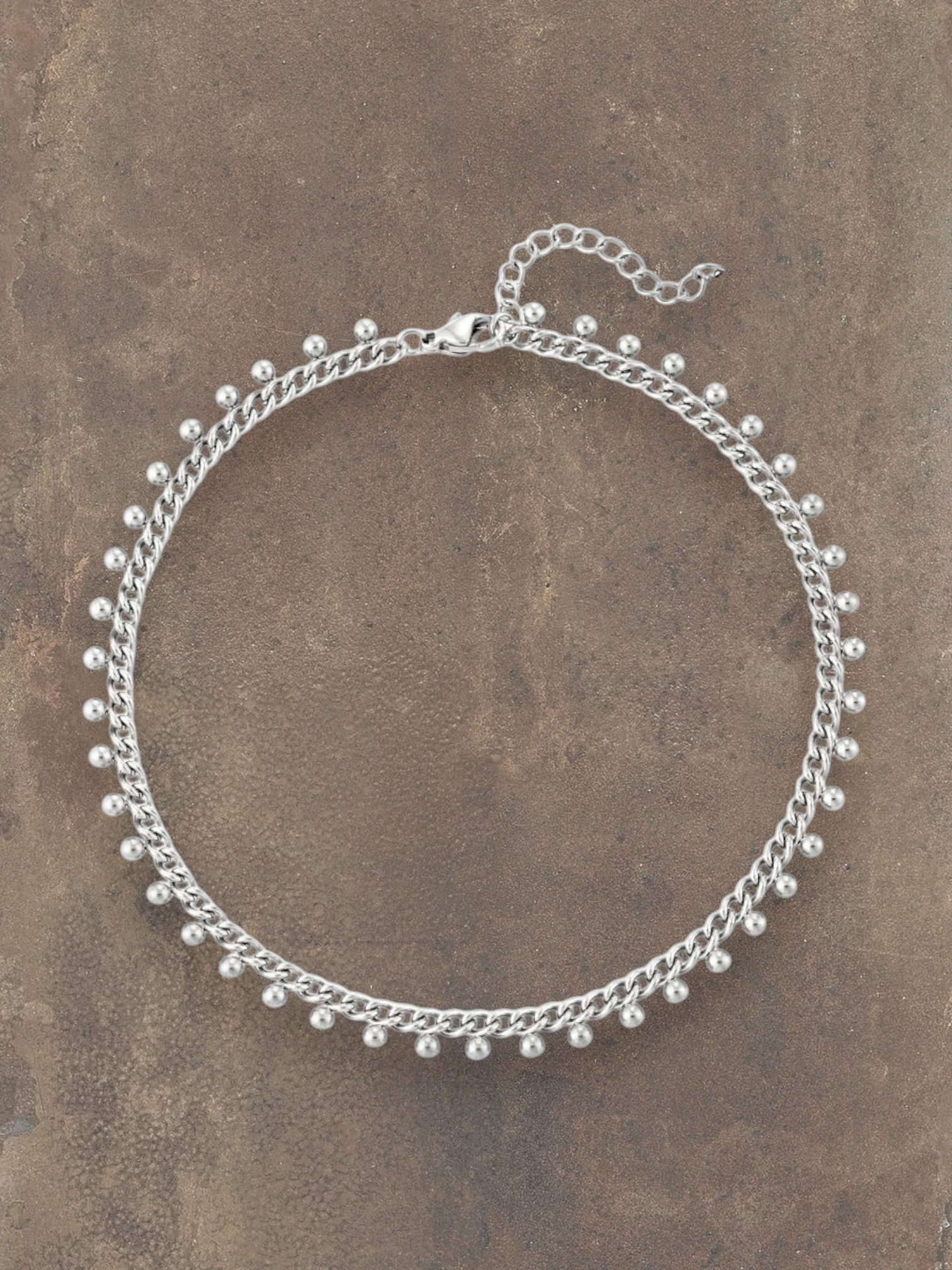 WILDSIDE silver-tone stainless steel chain anklet with small dangling charms and adjustable clasp.
