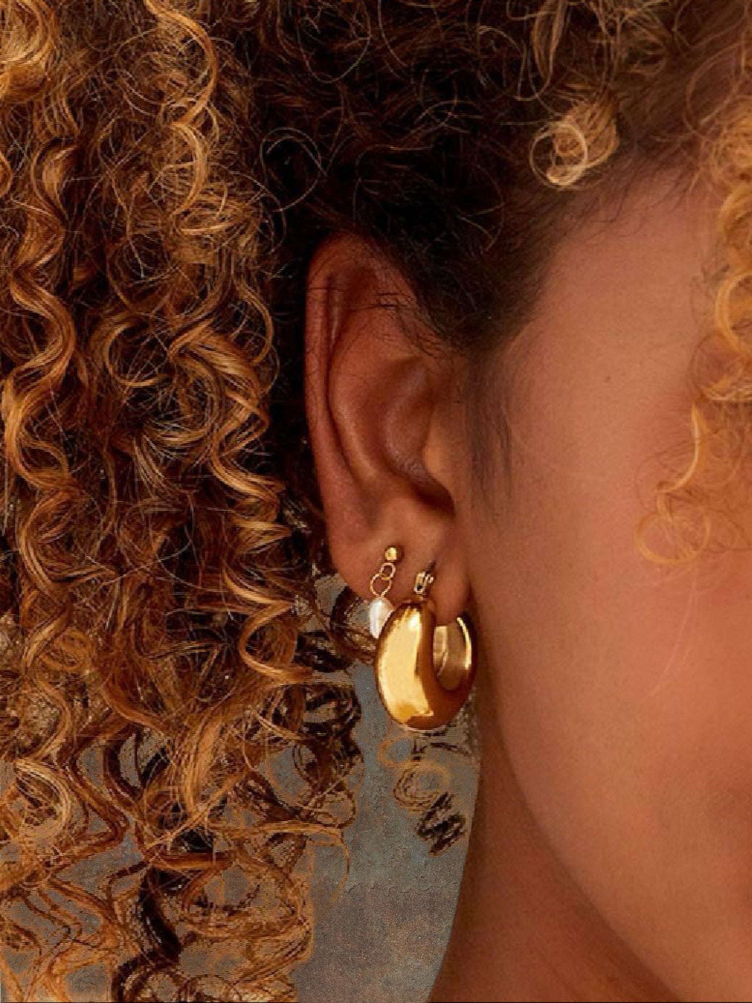 WILDSIDE polished gold-tone chunky dome hoop earrings with a rounded silhouette.