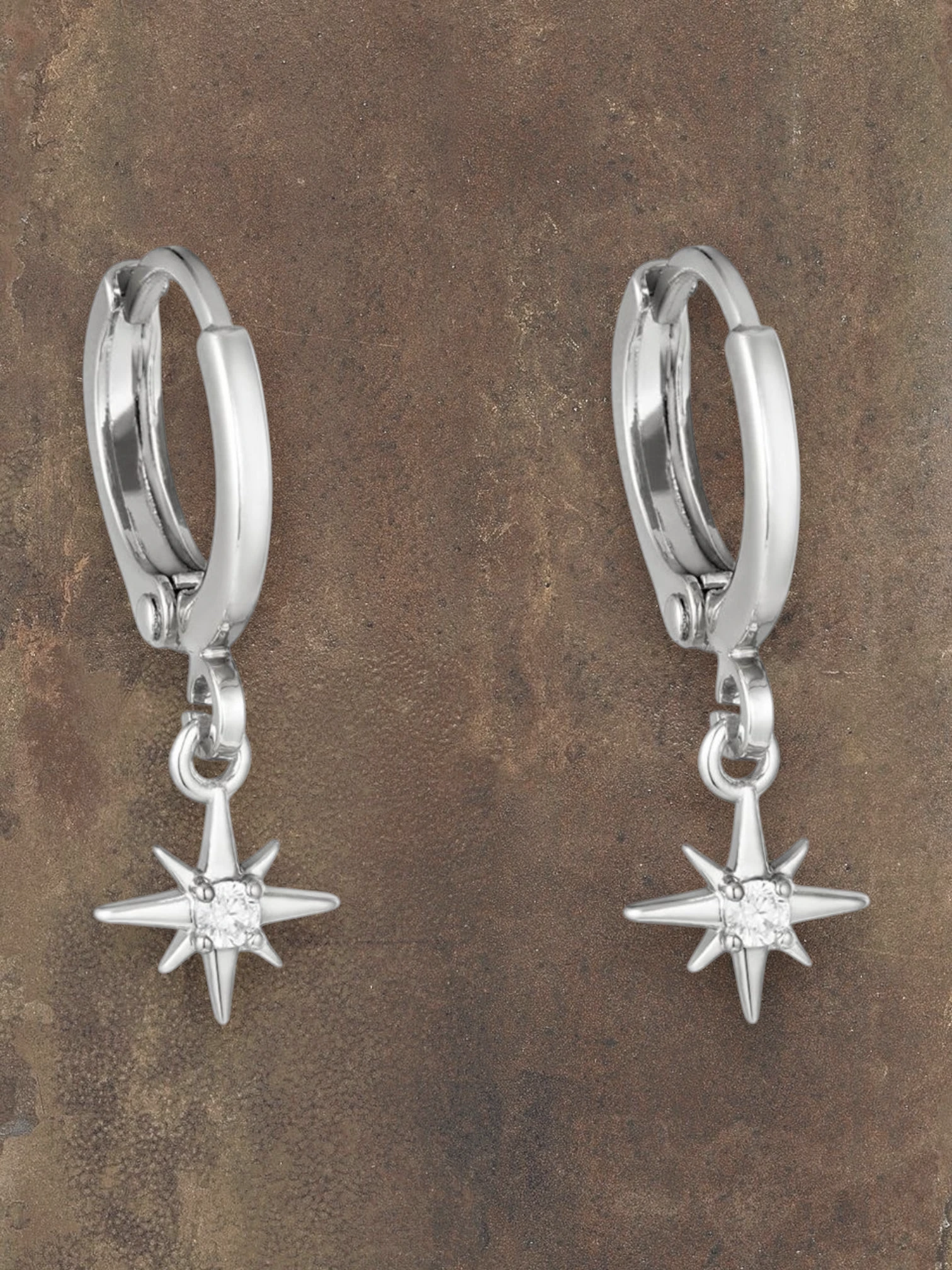 WILDSIDE silver hoop earrings with small star pendant and clear crystal accent.