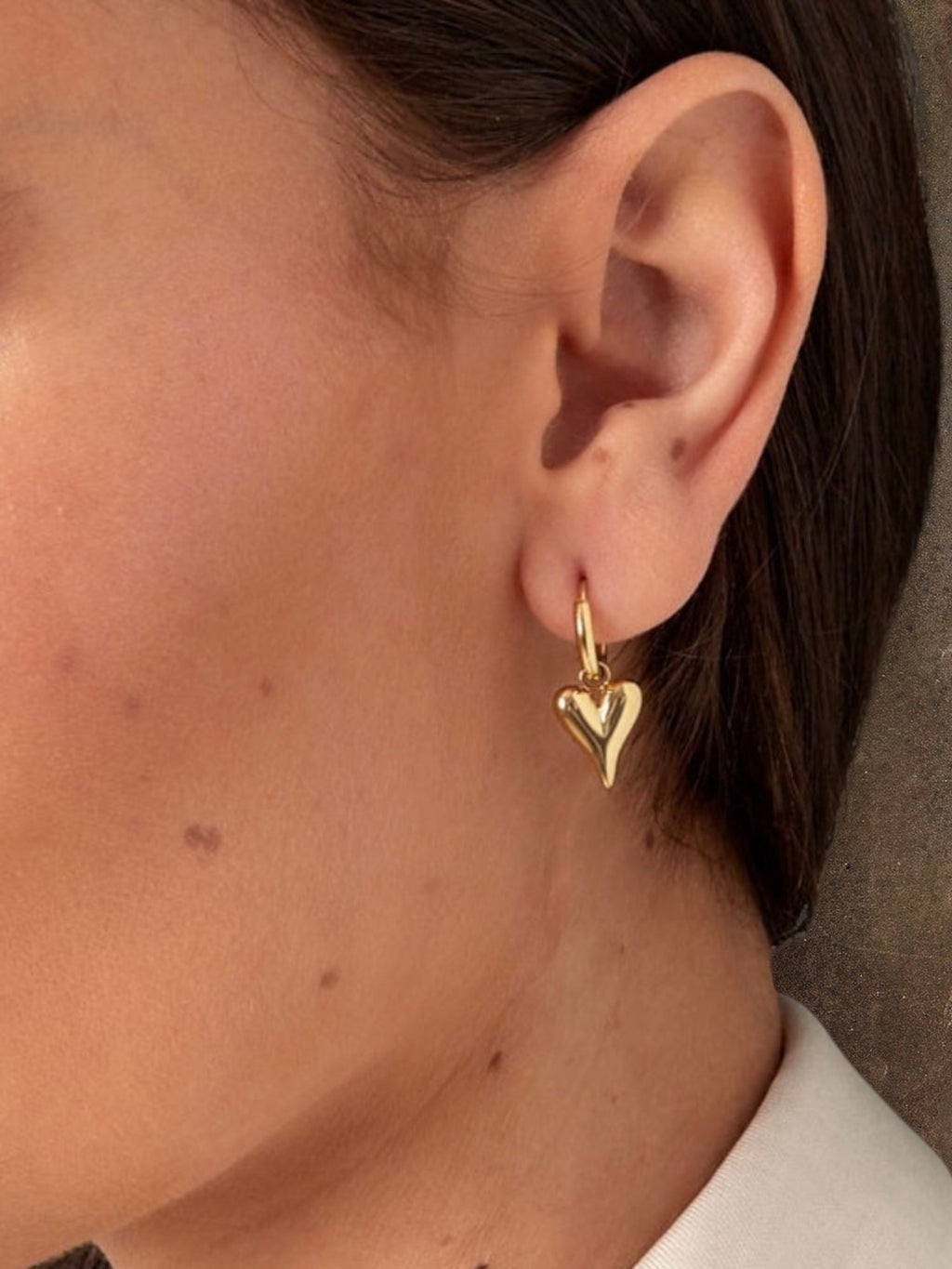 WILDSIDE gold puffy heart hoop earrings. Polished steel, lightweight, and comfortable for everyday wear.