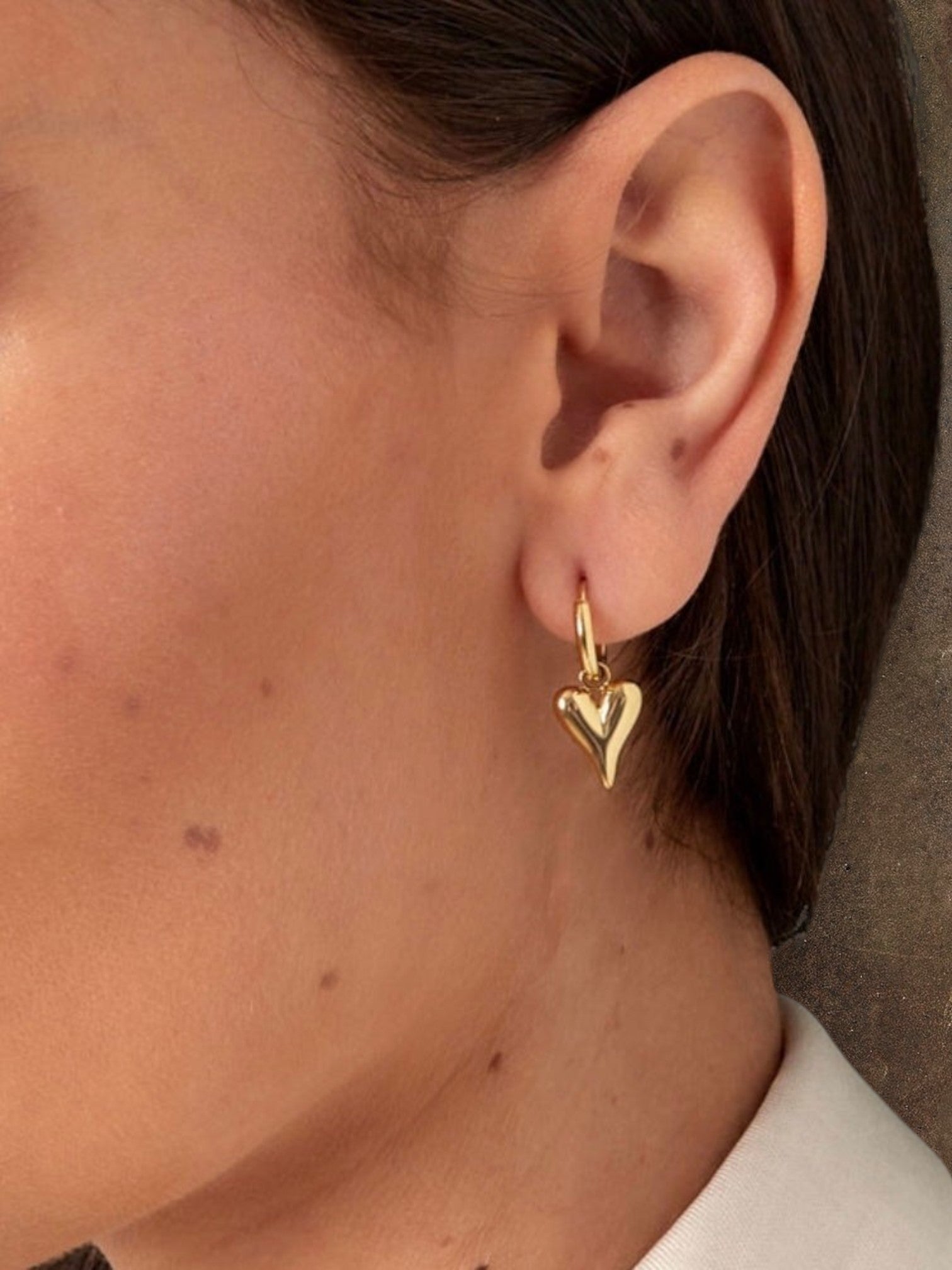 WILDSIDE gold puffy heart hoop earrings. Polished steel, lightweight, and comfortable for everyday wear.