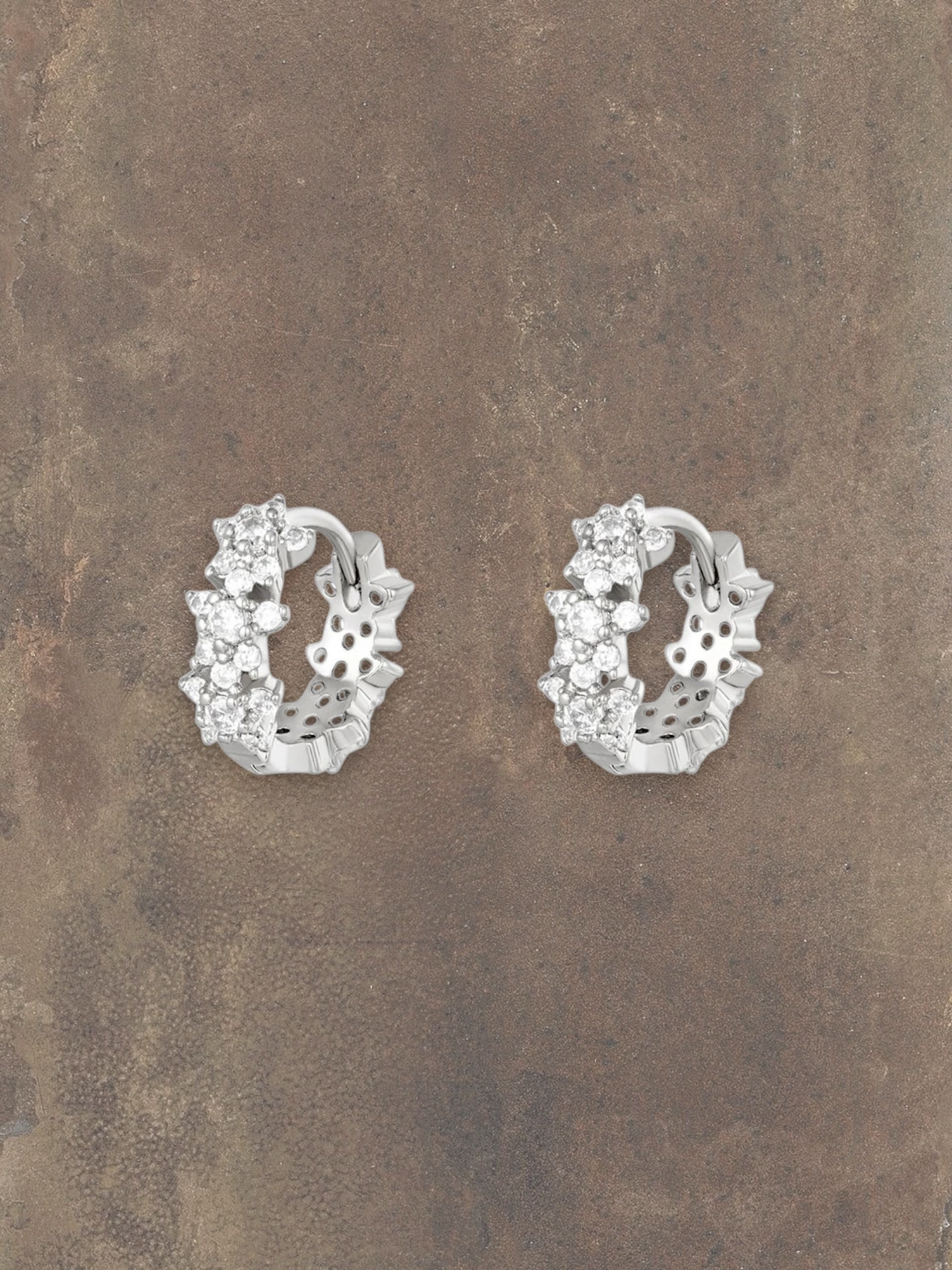 WILDSIDE small silver hoop earrings with sparkling stones, detailed floral design.