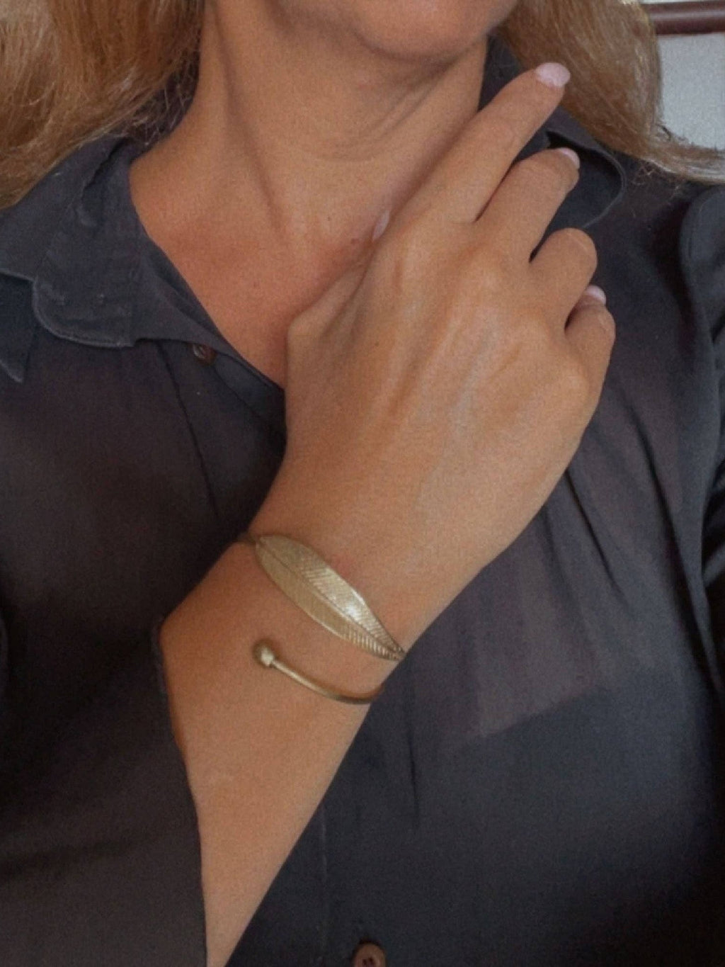 WILDSIDE polished brass leaf cuff bracelet with adjustable open design. Nature-inspired jewelry.