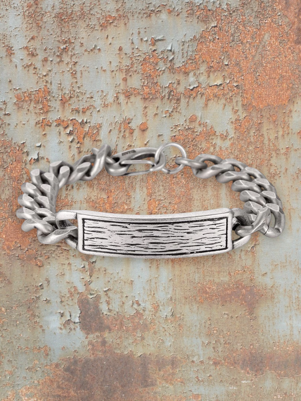 WILDSIDE silver stainless steel men's curb chain bracelet with textured ID plate and lobster clasp.
