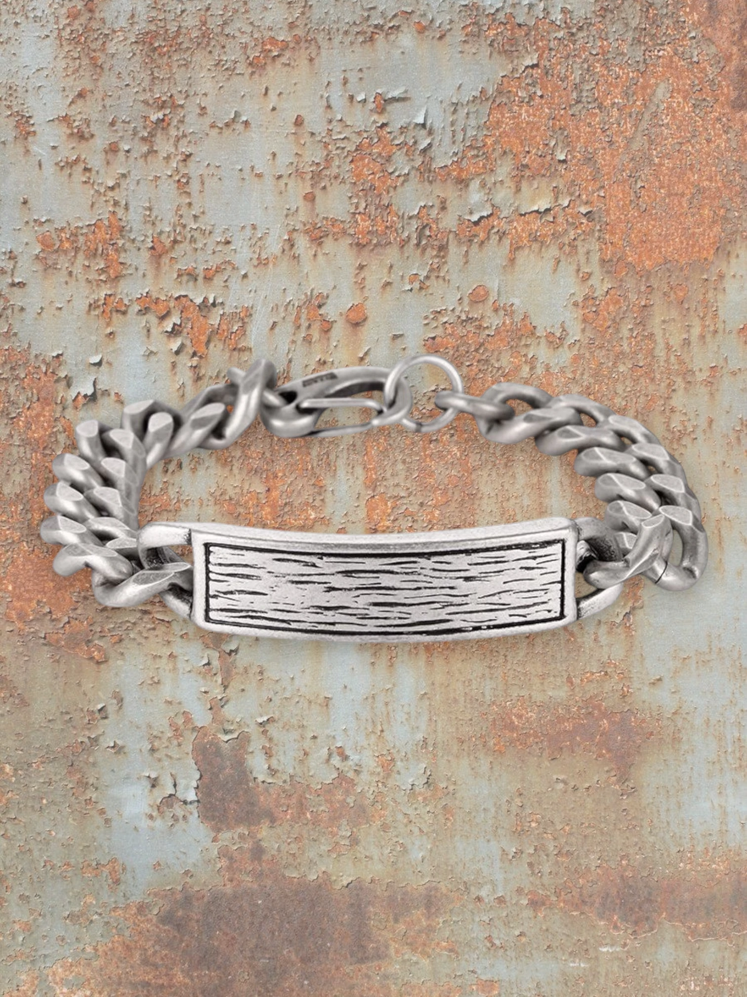 WILDSIDE silver stainless steel men's curb chain bracelet with textured ID plate and lobster clasp.