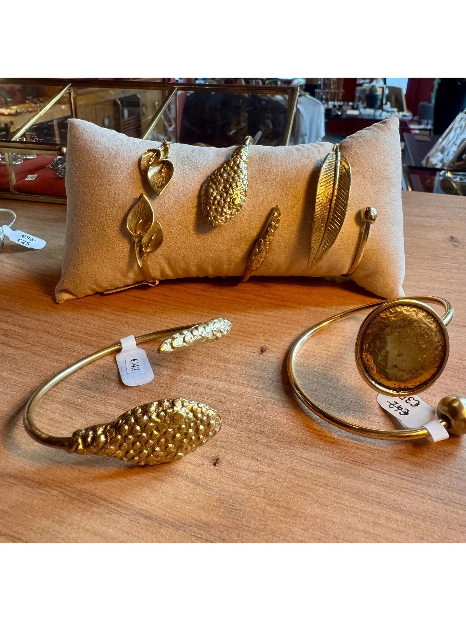 WILDSIDE golden leaf cuff bracelet with intricate leaf motifs, open cuff design, elegant botanical accessory.