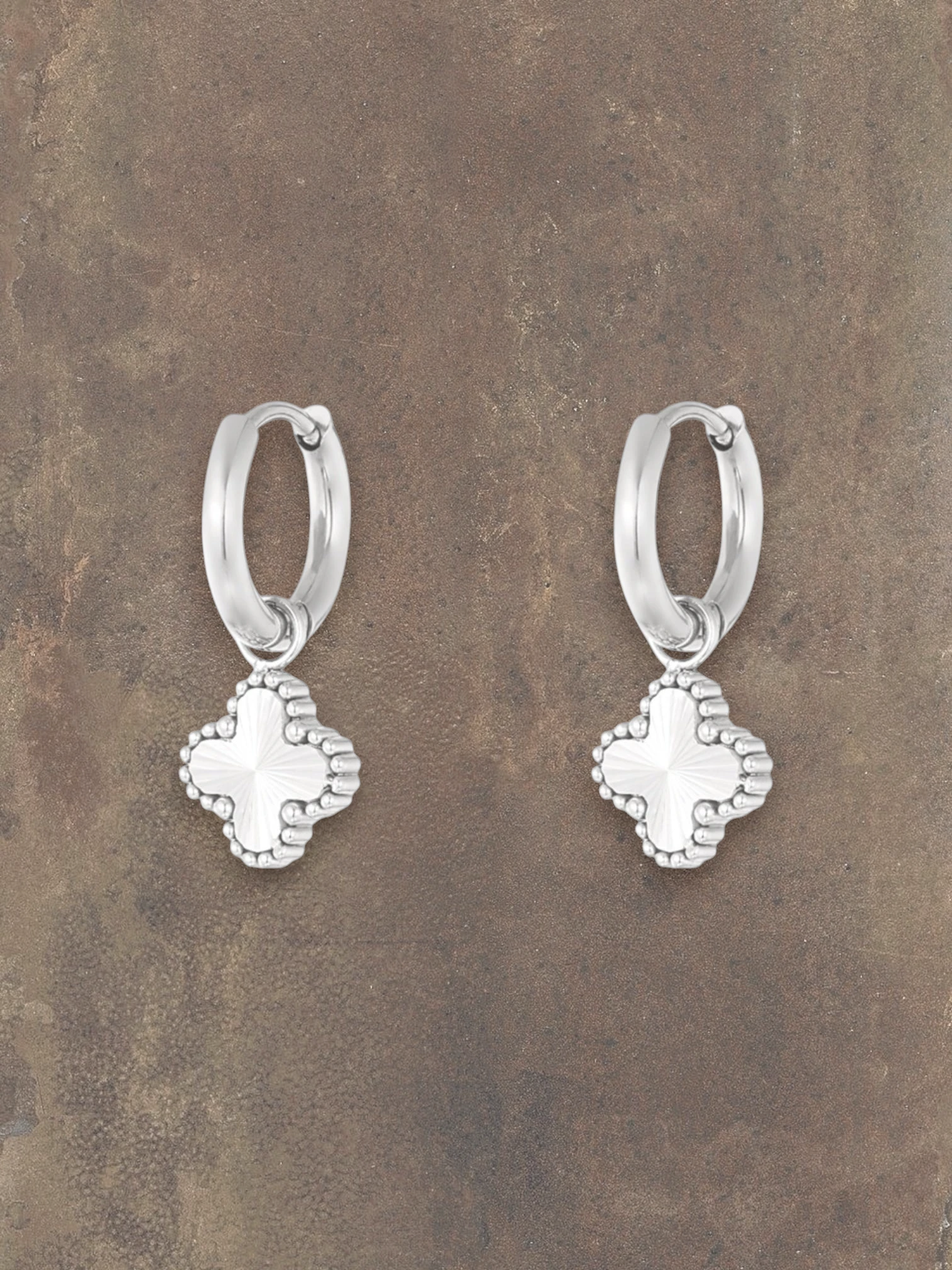 WILDSIDE silver color hoop earrings with clover pendant, textured finish.