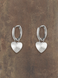 WILDSIDE silver-tone metal hoop earrings with textured heart charms. Perfect for everyday wear.