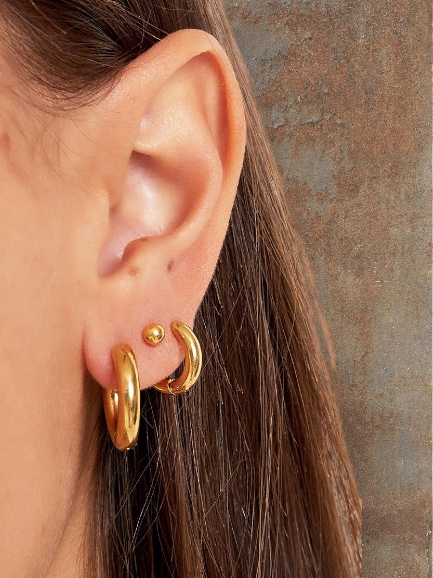 WILDSIDE gold mini hoop earrings and ball stud earrings set. Polished metal.