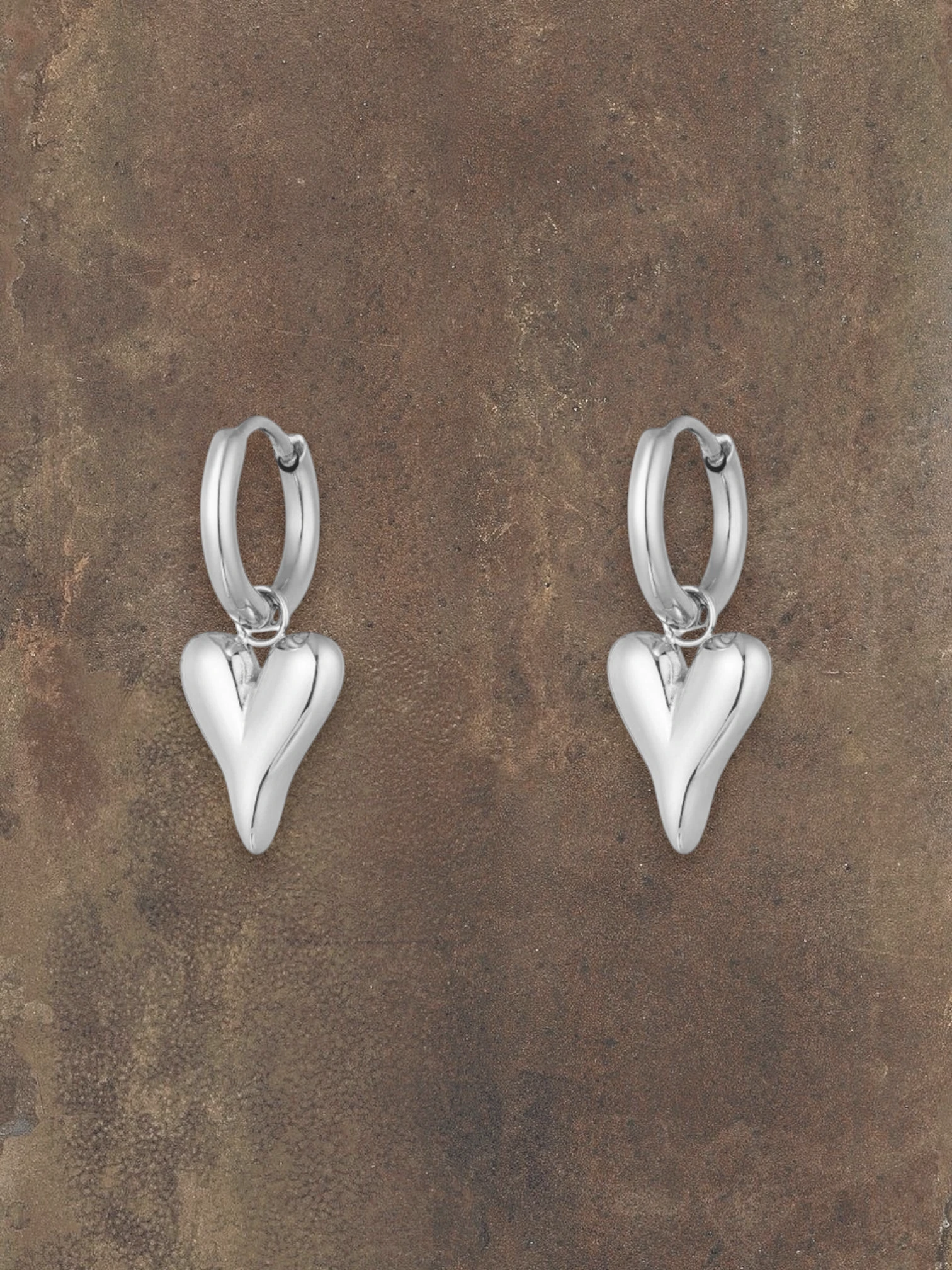 WILDSIDE silver steel puffy heart hoop earrings with polished finish, perfect for everyday wear.