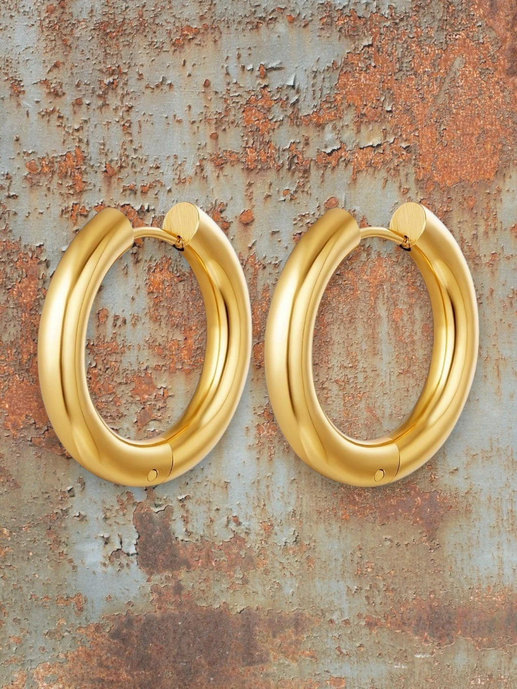 WILDSIDE polished gold-tone metal chunky hoop earrings. Bold, sophisticated, and versatile for any occasion.