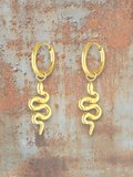 WILDSIDE gold-tone snake hoop earrings with intricate detailing. Edgy and elegant statement jewelry.