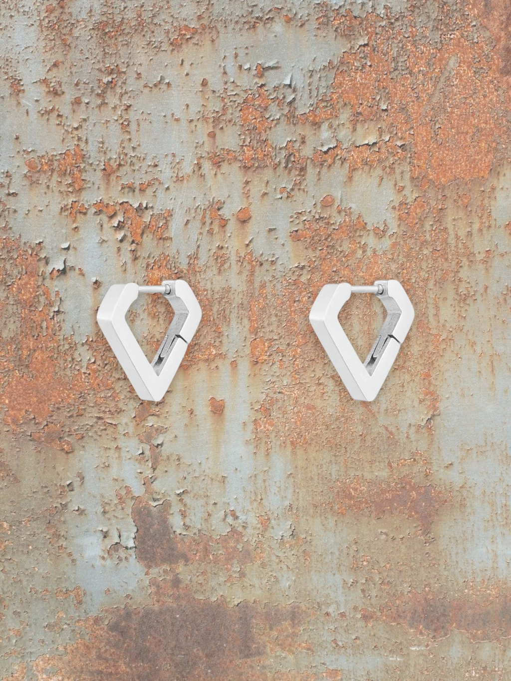 WILDSIDE white geometric diamond hoop earrings with a polished finish.