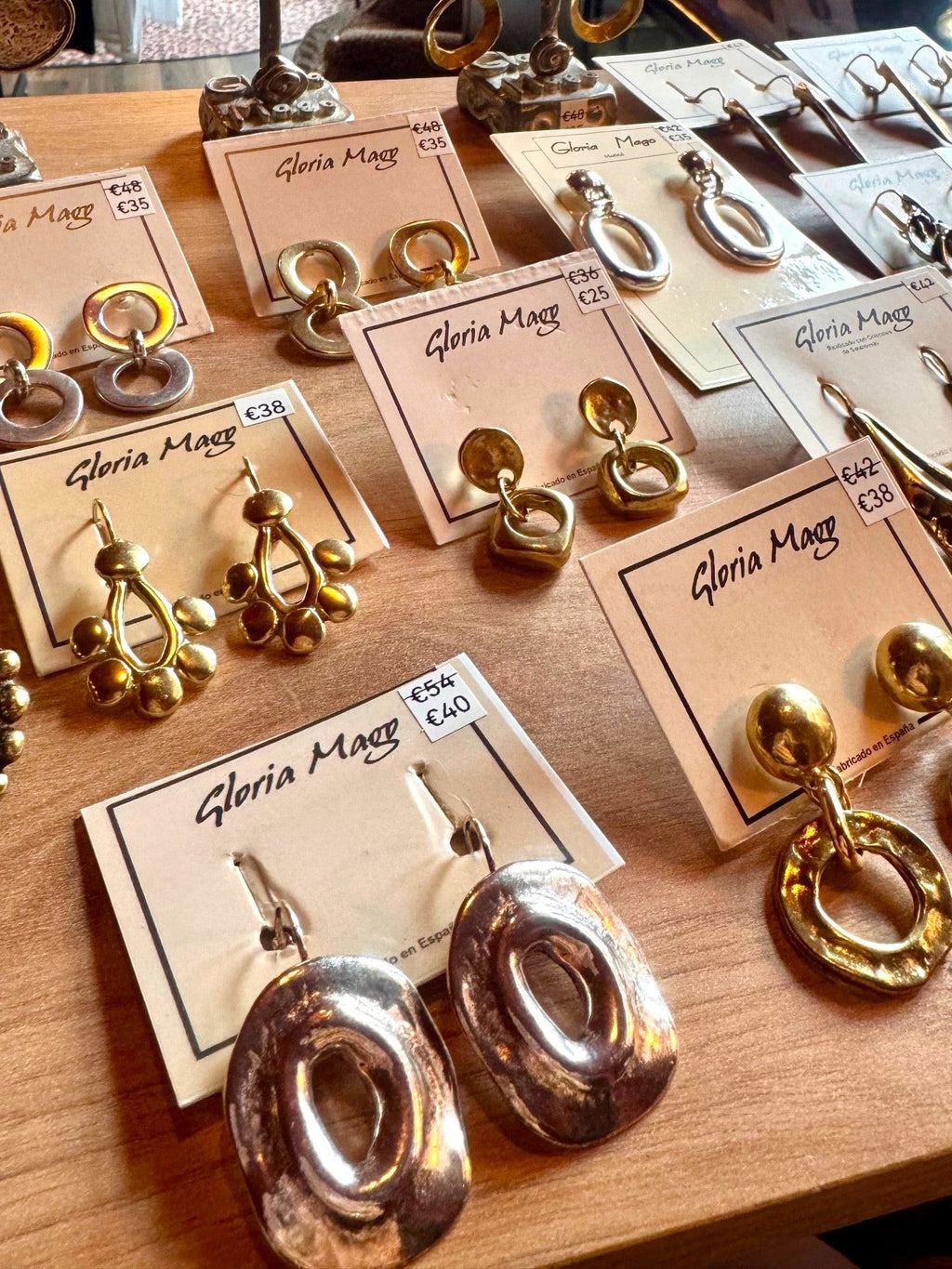 WILDSIDE double hoop pendant earrings in gold-plated zamak. Anti-allergenic, sustainable design.