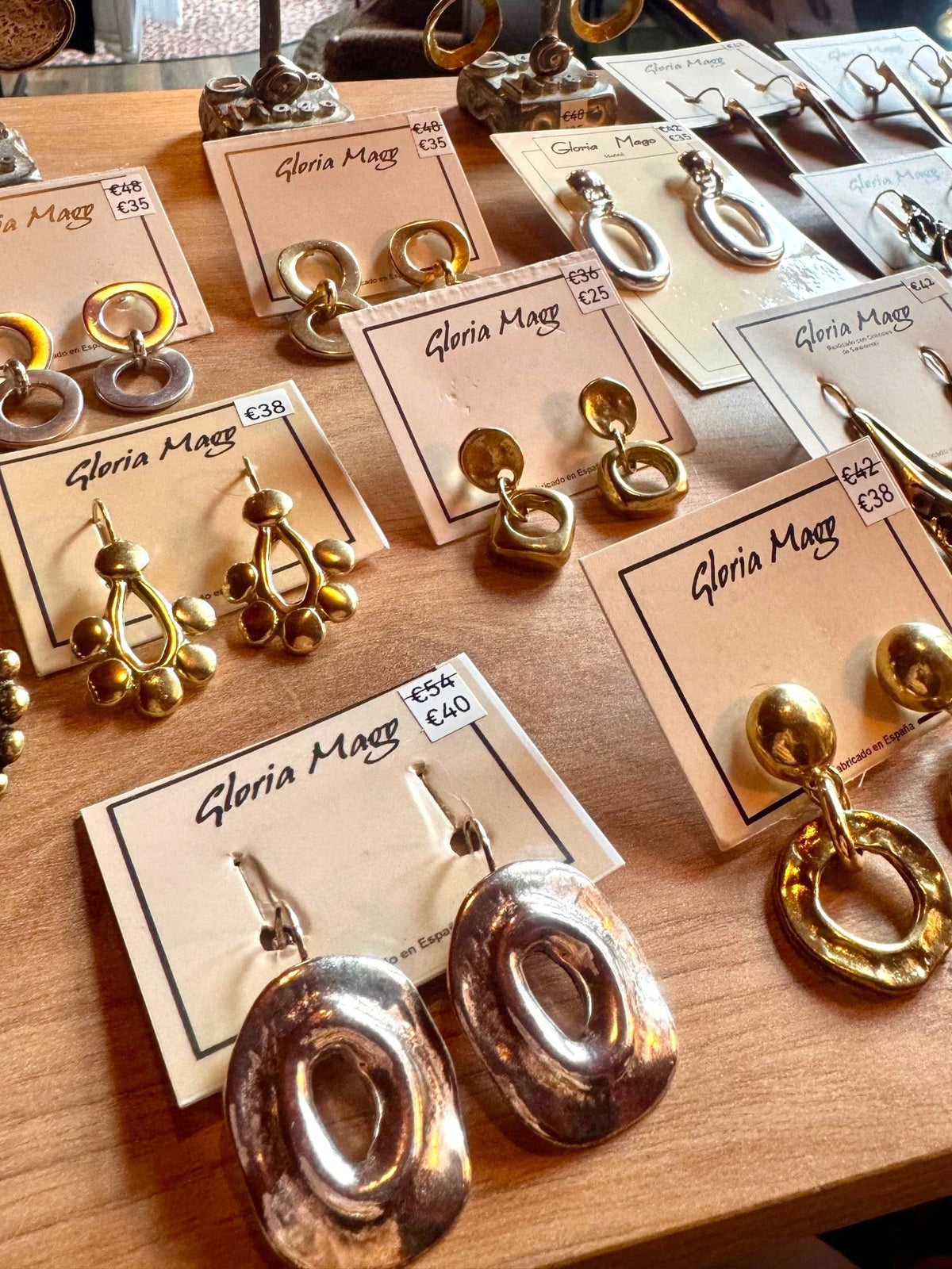 WILDSIDE double hoop pendant earrings in gold-plated zamak. Anti-allergenic, sustainable design.