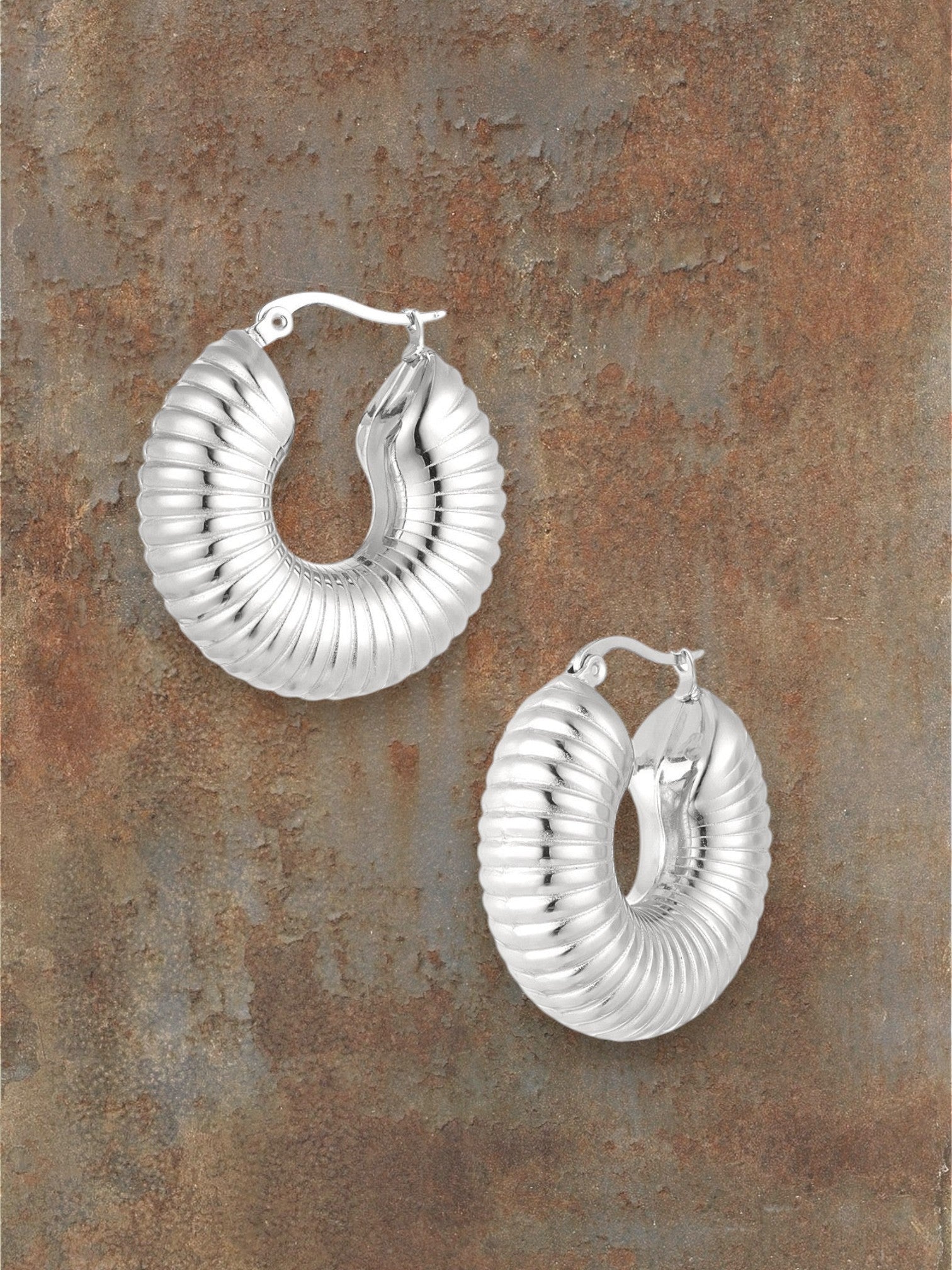 WILDSIDE silver textured hoop earrings with ribbed detail, polished steel, perfect for day or night.