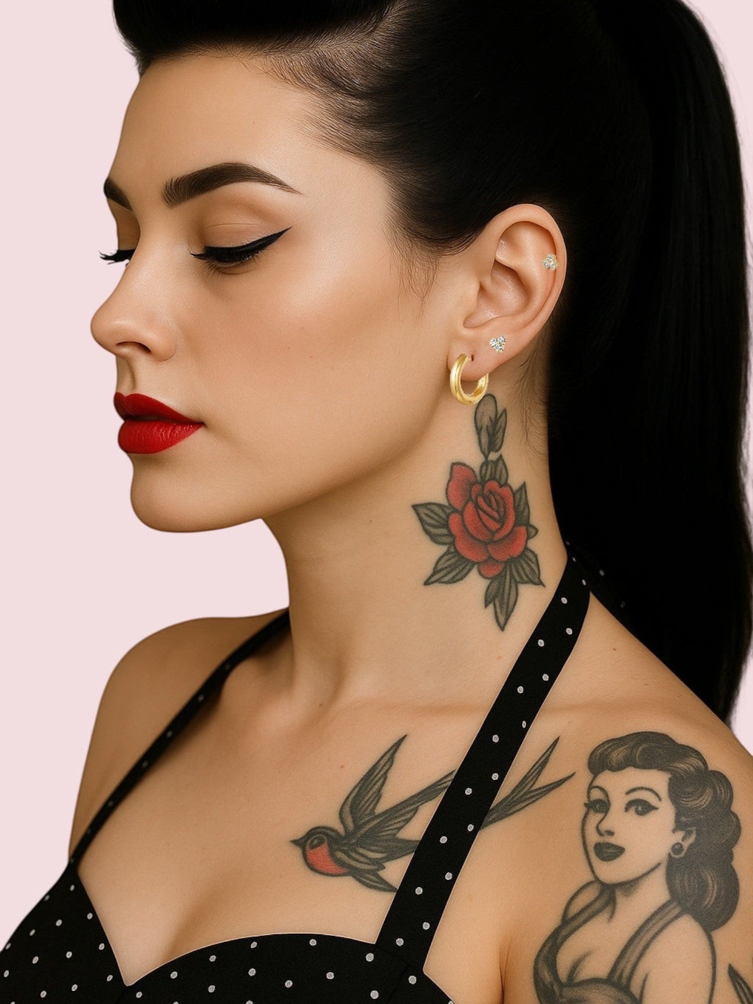 WILDSIDE medium thick polished gold hoop earrings with small stud earrings.