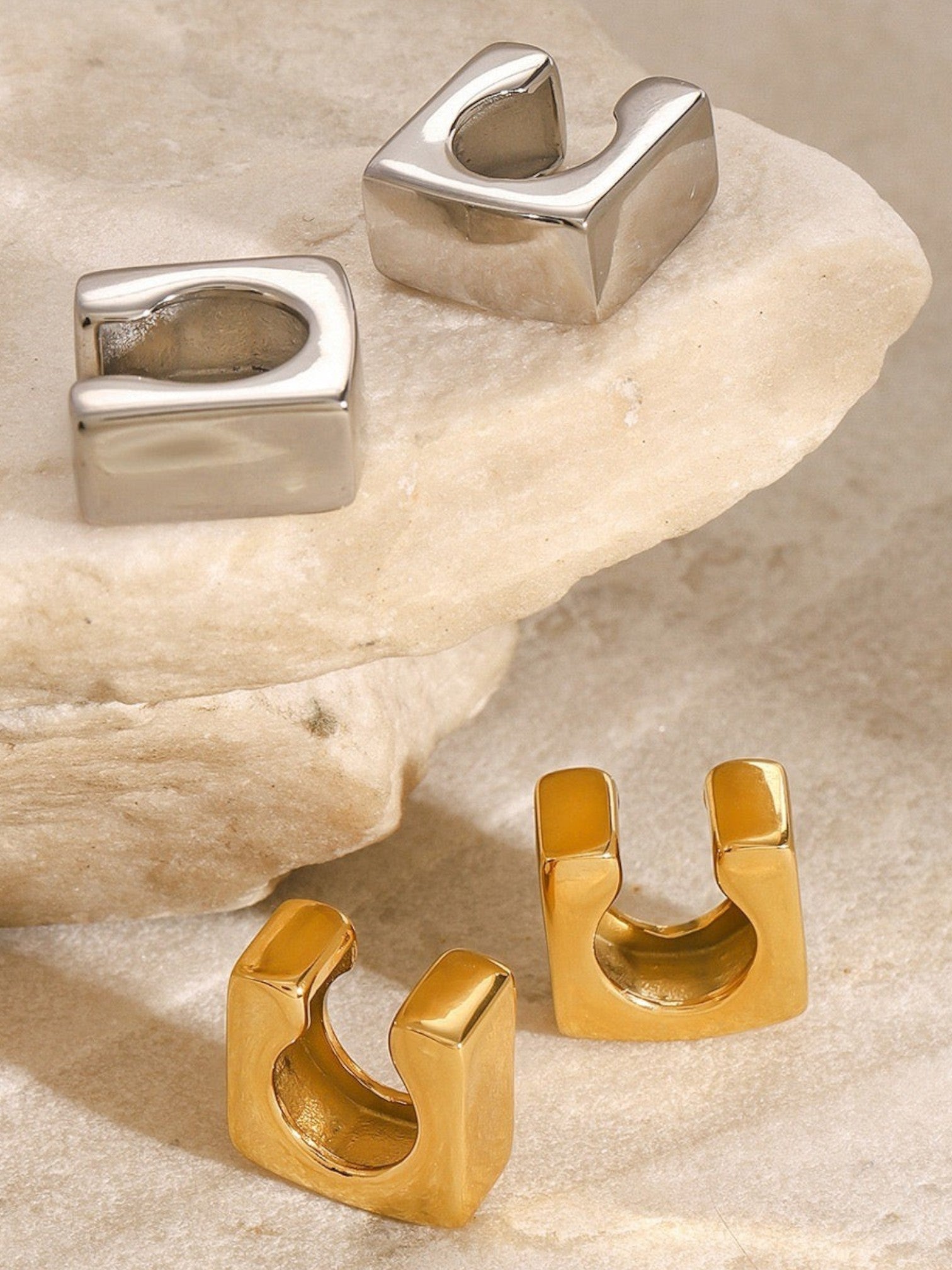 WILDSIDE statement ear cuffs in silver and gold tones. Modern, minimalist design, no piercing needed.