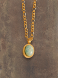WILDSIDE gold chain necklace with oval turquoise pendant, made of stainless steel.
