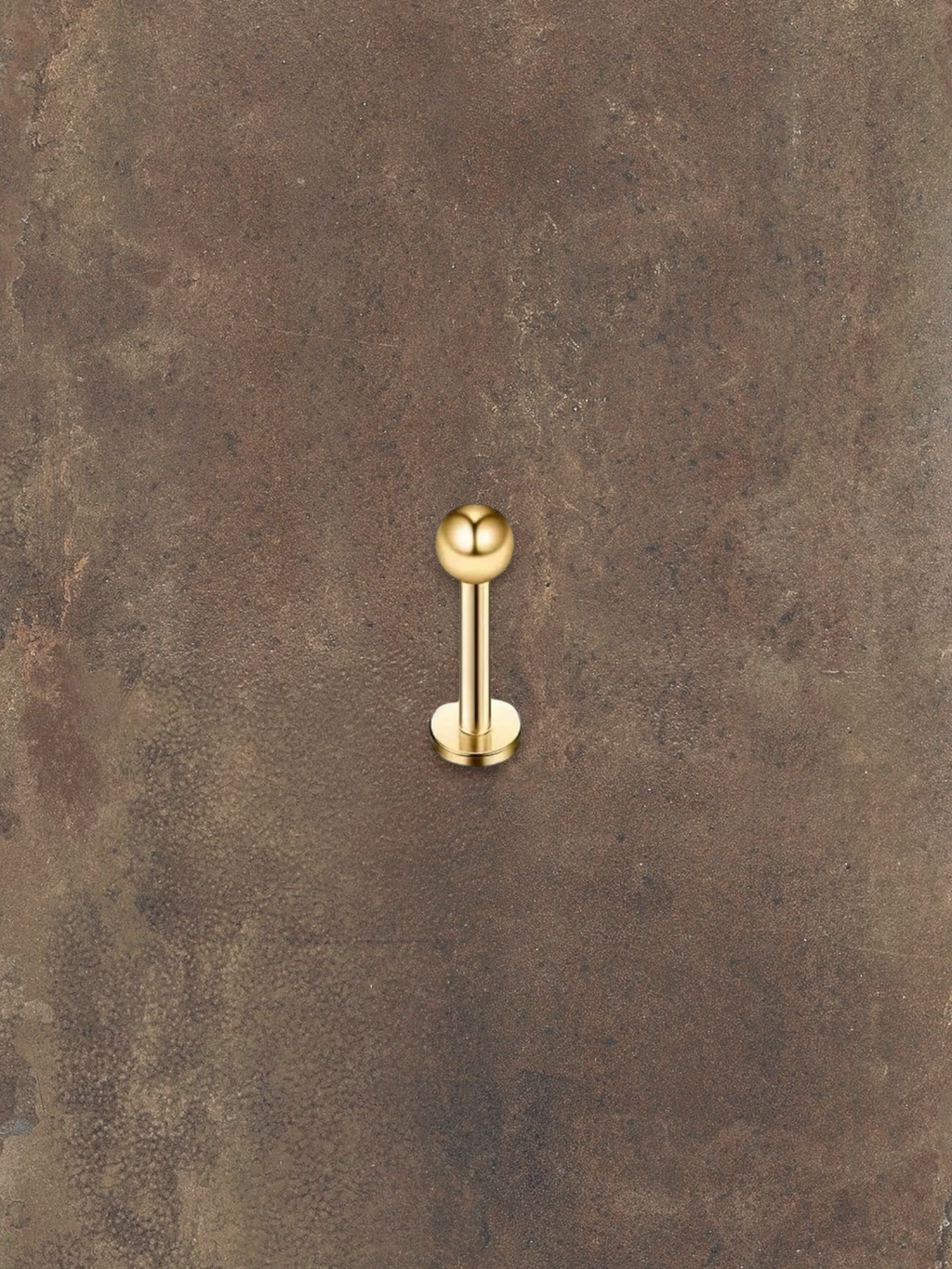 WILDSIDE gold labret piercing with a ball end and flat disc base. Elegant, minimalist jewellery.