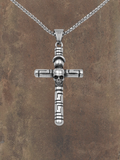 WILDSIDE silver stainless steel cross pendant with skull detail and Greek key design. Hand-polished.